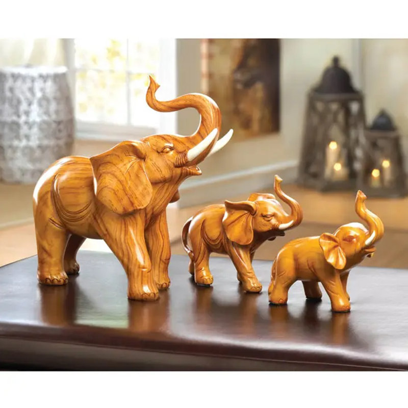 Set of Three Light Brown Wooden Elephant Figurines
