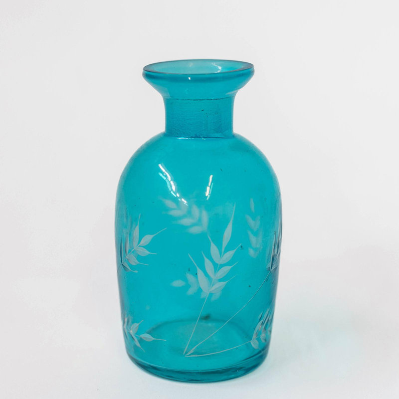 Bleu vif avec bouteille décorative carrée à imprimé de feuilles blanches
