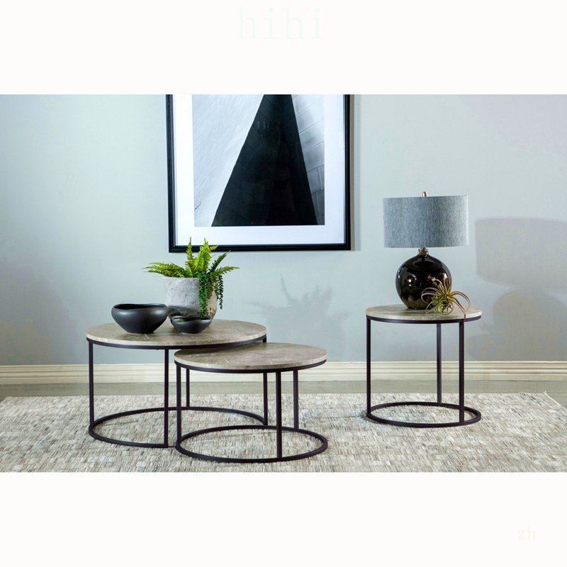 Table basse relevable Amara en chêne doré et noir avec finition imitation marbre pour des espaces de vie modernes et polyvalents