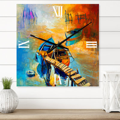 Horloge murale bateau pendant la lueur du soir au lac V