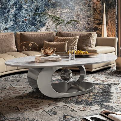 Fantastic Luxurious Oval Faux Marble Coffee Table With Midsize Sphere Crescent-Shaped Base by Everly Quinn