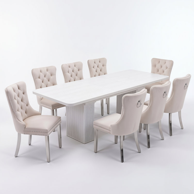 Ensemble de salle à manger extensible pour 4 à 8 personnes avec des chaises rembourrées en velours et une table centrale à double pied