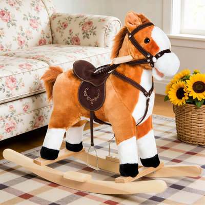 Cheval à bascule en peluche pour enfants, doux et interactif pour le développement musculaire et l'imagination.