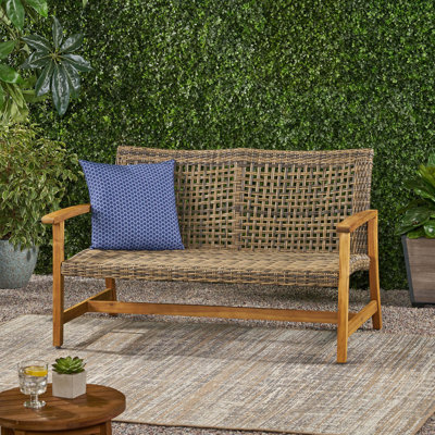 Causeuse d'extérieur en osier avec coussin
