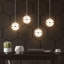 Luminaire suspendu à 4 lumières Adetoun Orb