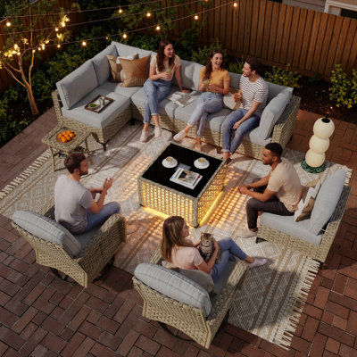 10-piece outdoor wicker patio furniture set with fire pit table, swivel chair and colorful cushions