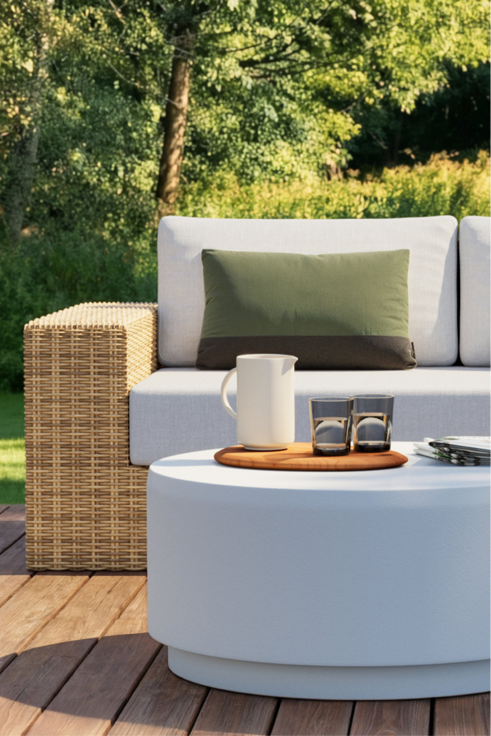 Outdoor patio setup with rattan sofa and round coffee table.