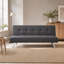 Mobilier gris pliant en tissu à double usage, placé dans le salon, en un clic entre le canapé et le lit