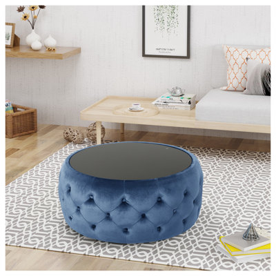 Repose-pieds rond en velours bleu foncé