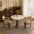 Sculpted Wood Pedestal Dining Table with Woven Wicker Detail & Round Stone Surface-179303938