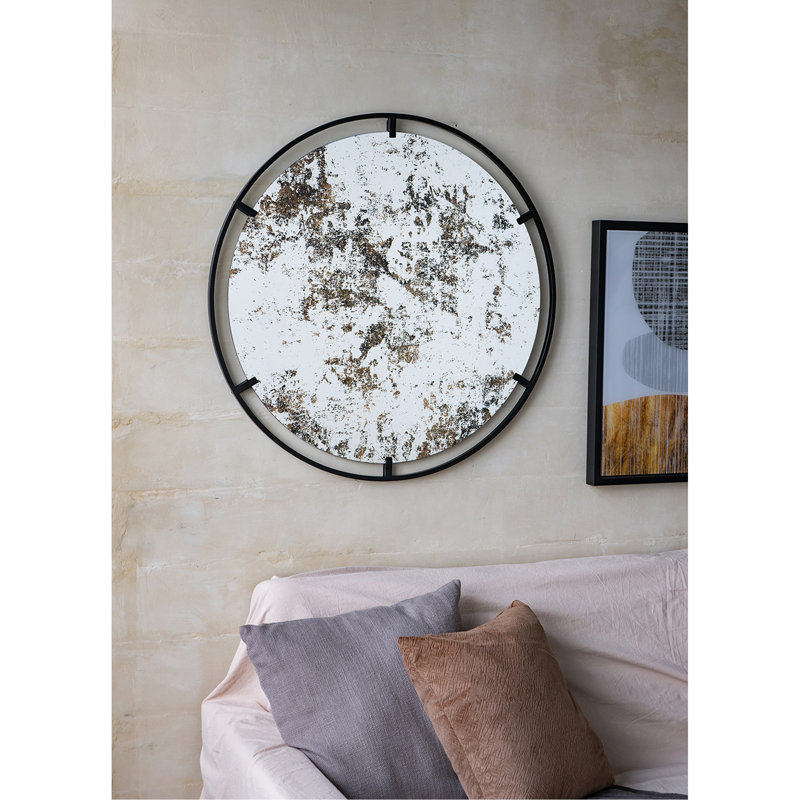 Miroir rond industriel à cadre métallique unique pour une décoration murale élégante