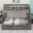 Sturdy bunk bed setup with a trundle and ladder-1702932219
