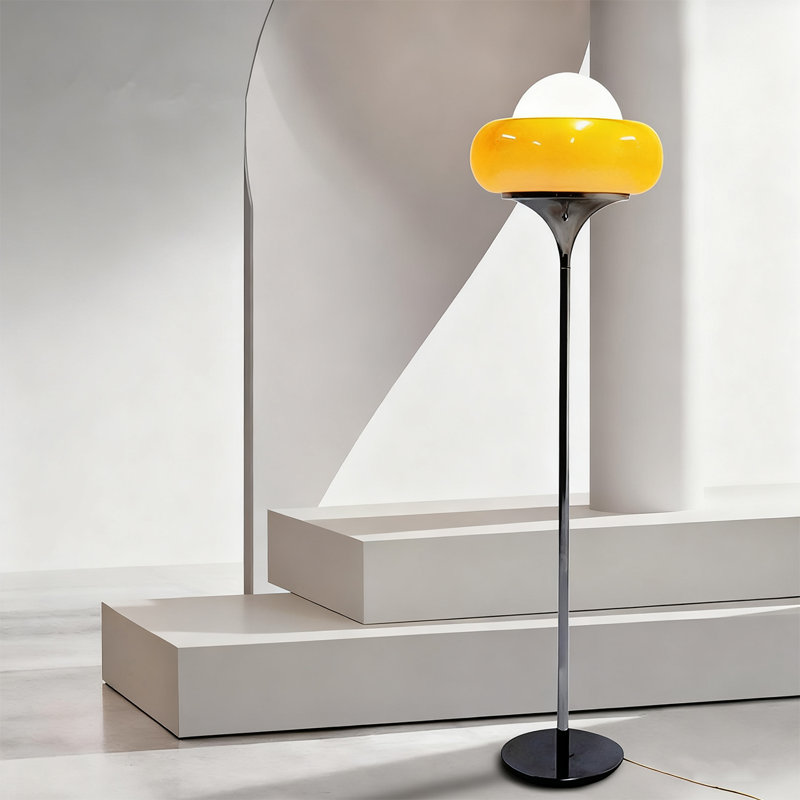 A Bauhaus-style egg tart-shaped iron and glass floor lamp