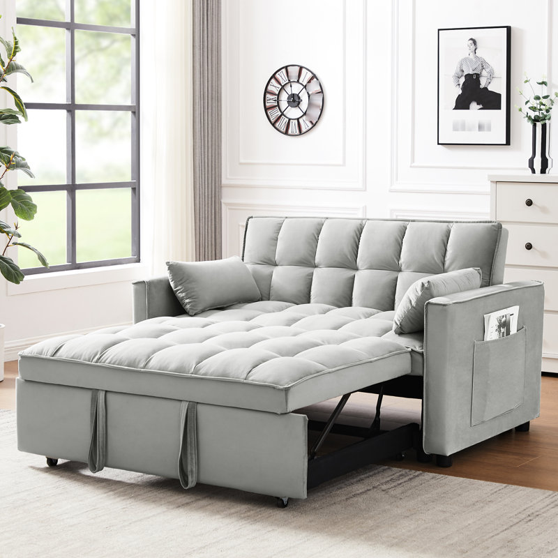 Salon moderne avec lit gigogne et poches en velours gris