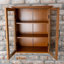 Armoire de rangement murale amovible à deux portes avec panneaux de verre et tablettes réglables Yarissa