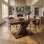 Table de salle à manger extensible moderne de 71 pouces, base en métal en forme de X décalée, finition en mélamine grain de bois, peut accueillir 6 à 8 personnes, polyvalente pour la cuisine ou la salle à manger