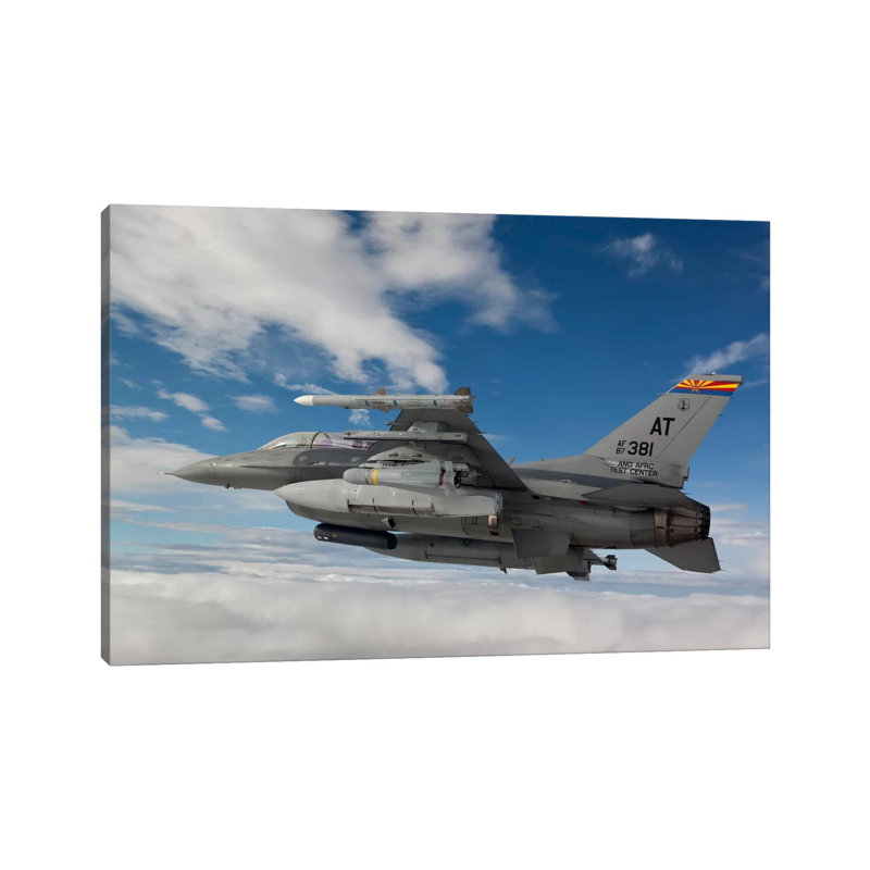 F-16 Fighting Falcon Flies With An AGM-65 Maverick Missile by HIGH-G Productions - Wrapped Canvas Print