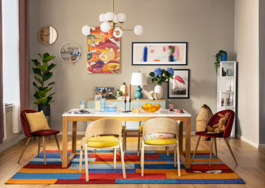 eclectic maximalism dining room with colorful geometric area rug