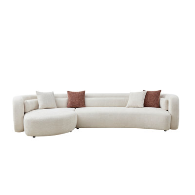 Canapé modulaire incurvé moderne, bouclé beige clair, design spacieux en forme de L pour les salons contemporains