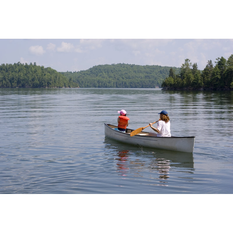 Mother And Daughter Canoeing by ImageegamI - Wrapped Canvas Print, 30cm H x 46cm W 