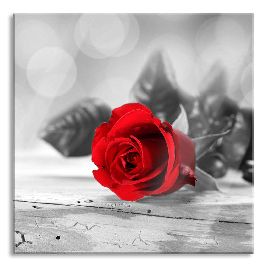 Glasbild Rose on Wooden Table