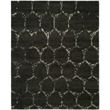 Levasy Geometric Area Rug in Black