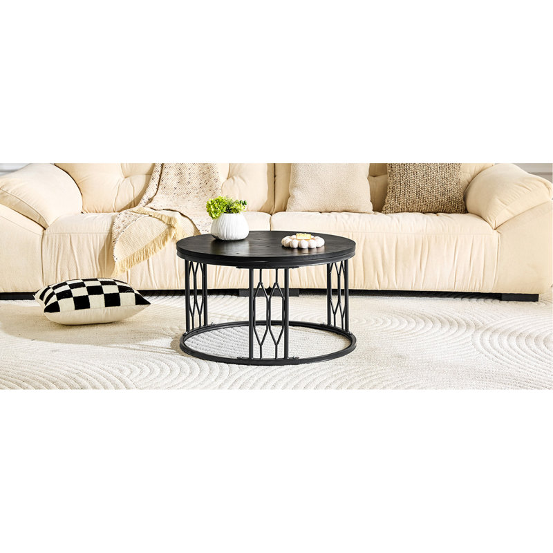 Table basse noire ronde en panneau de fibres à densité moyenne de 27,5 pouces de diamètre. Une table basse ronde pour le salon au design industriel rustique, avec des pieds en métal robustes et un assemblage facile.