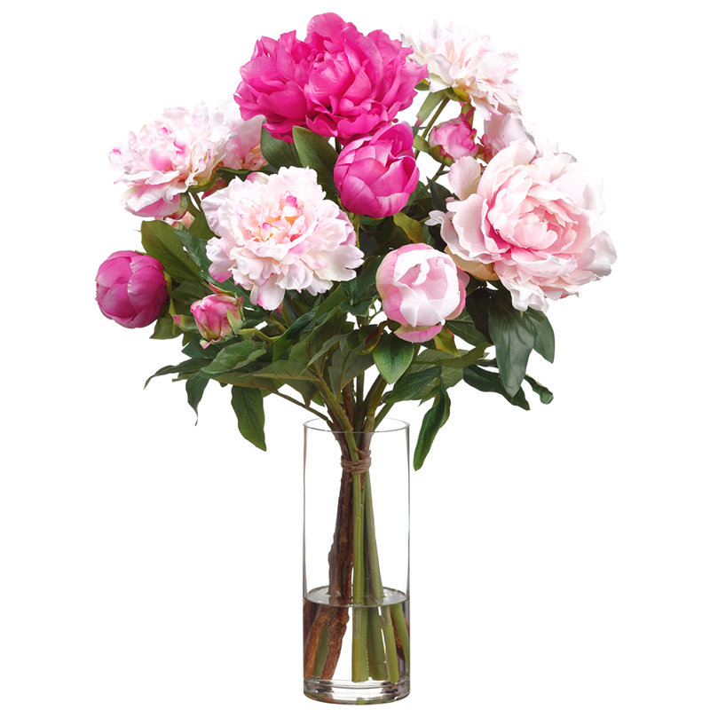 Arrangement de pivoines dans un vase en verre rose deux tons