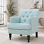 Fauteuil club capitonné en tissu avec garniture cloutée et pieds en bois de bouleau
