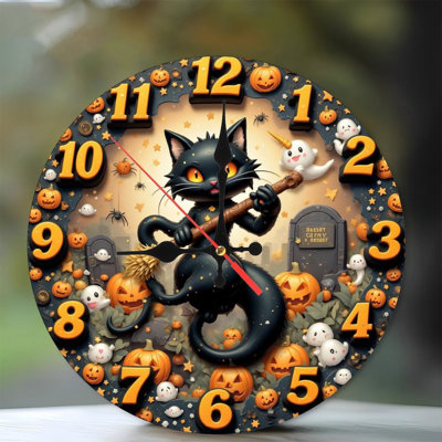 Horloge noire d'Halloween avec des citrouilles