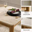 Table de salle à manger COLAMY VERSE 63 po avec plateau aspect pierre et grain de bois chaleureux