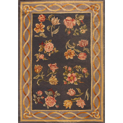 Tapis noué à motif floral antique