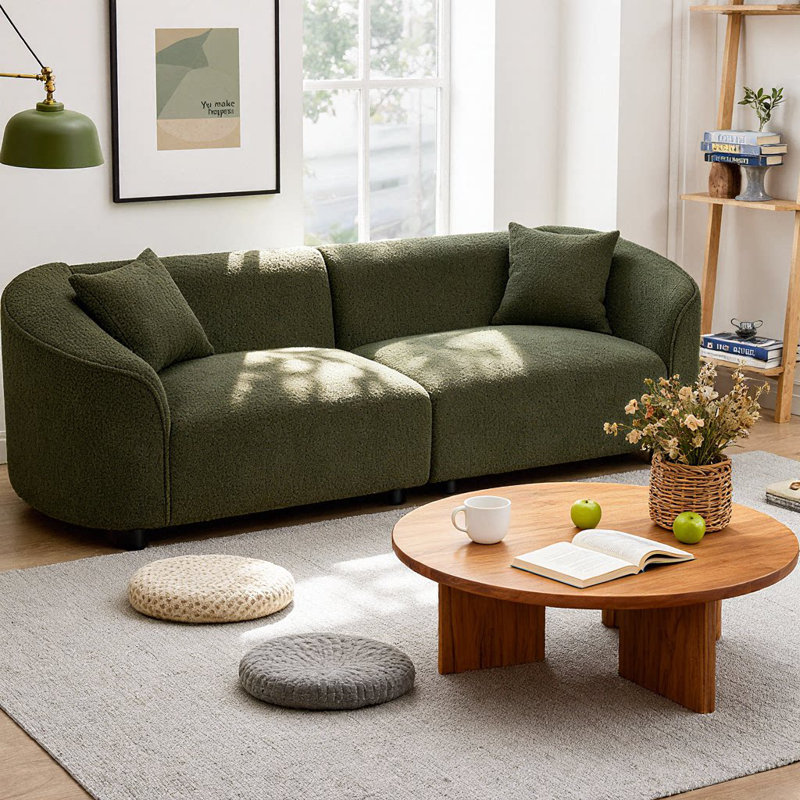 Canapé 3 places contemporain incurvé Element 87" au design sculptural, revêtement en bouclé moelleux et structure en bois massif, assise ergonomique pour salon ou lounge