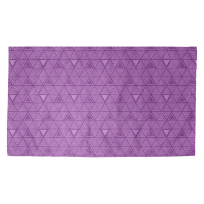 Tapis mauve à motif de triangles dessinés à la main