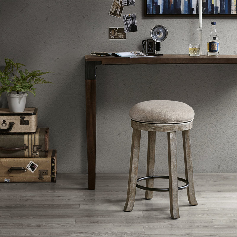 Tabouret de comptoir pivotant gris légèrement délavé avec revêtement texturé et dossier terni