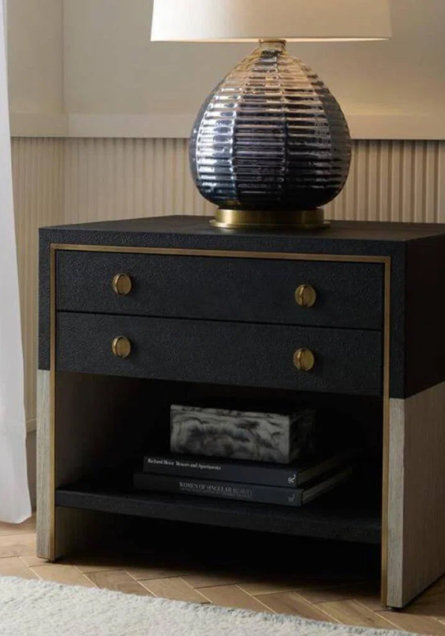 Nightstand with two drawers and a table lamp on top