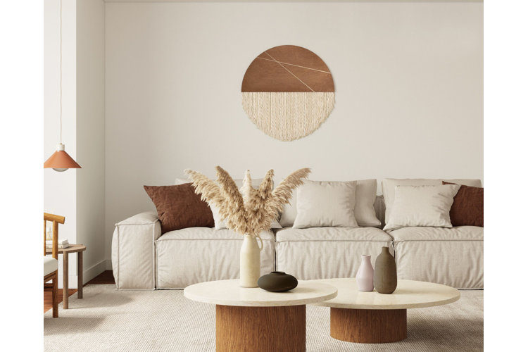 Desert modern interior design living room with white sofa, rug, and coffee tables with wood bases