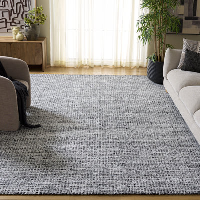 Tapis ivoire / noir en laine et coton touffetés à la main Glamour
