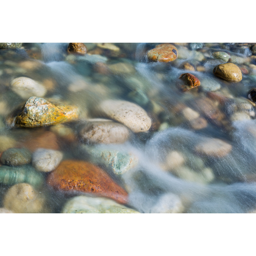 Leinwandbild Pebble Stones In The River Water Close Up View