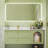 Simple green bathroom cabinet.