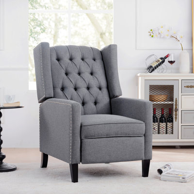 Fauteuil capitonné pour le salon