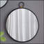 Miroir mural contemporain avec cadre noir élégant, idéal pour rehausser le décor de n'importe quelle pièce et créer une ambiance spacieuse.