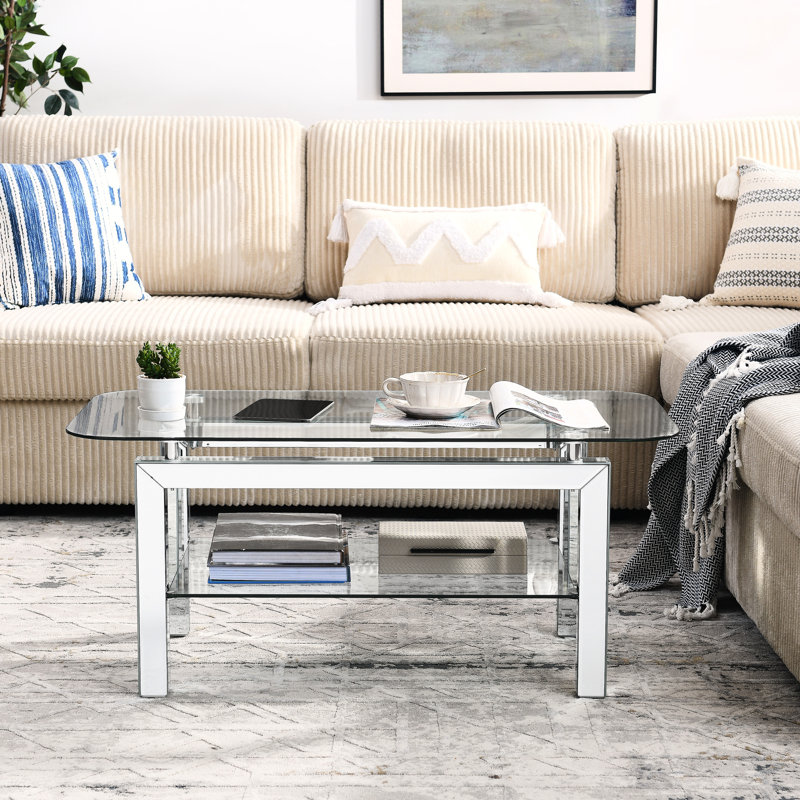 Élégante table basse rectangulaire en verre trempé avec tablette et pieds en miroir
