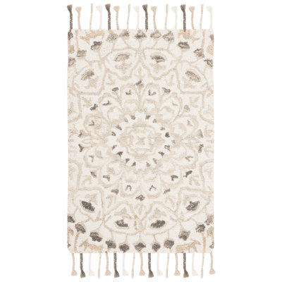 Jahiem Floral Handwoven Wool Area Rug in Ivory/Taupe