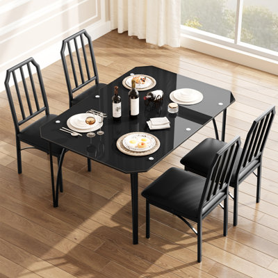 Ensemble table et chaises de salle à manger pour 4 personnes avec plateau en verre noir, style moderne, sièges rembourrés, mobilier gain de place idéal pour appartement ou petit espace, montage facile