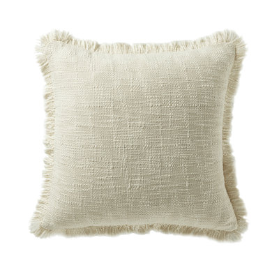 Coussin décoratif bohème en coton texturé flammé avec franges à pompons