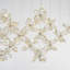 Lustre linéaire en cristal 8 lumières avec acier inoxydable chromé et fleurs de cristal transparent