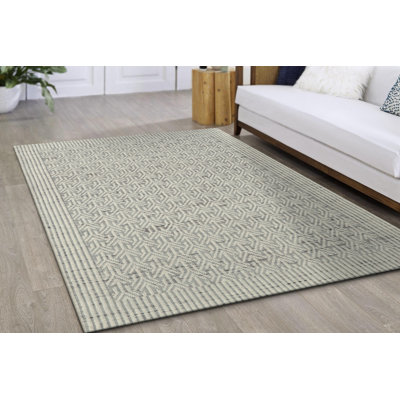 Tapis géométrique beige tissé à la main
