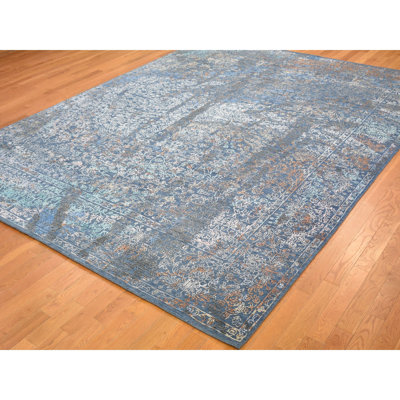 Tapis décoratif noué à la main bleu de conception unique 9 pi x 12 pi Ariea