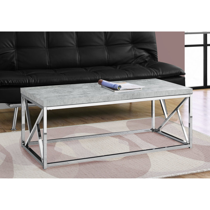 Table basse spacieuse rectangulaire en stratifié gris avec détails métalliques d'inspiration industrielle moderne